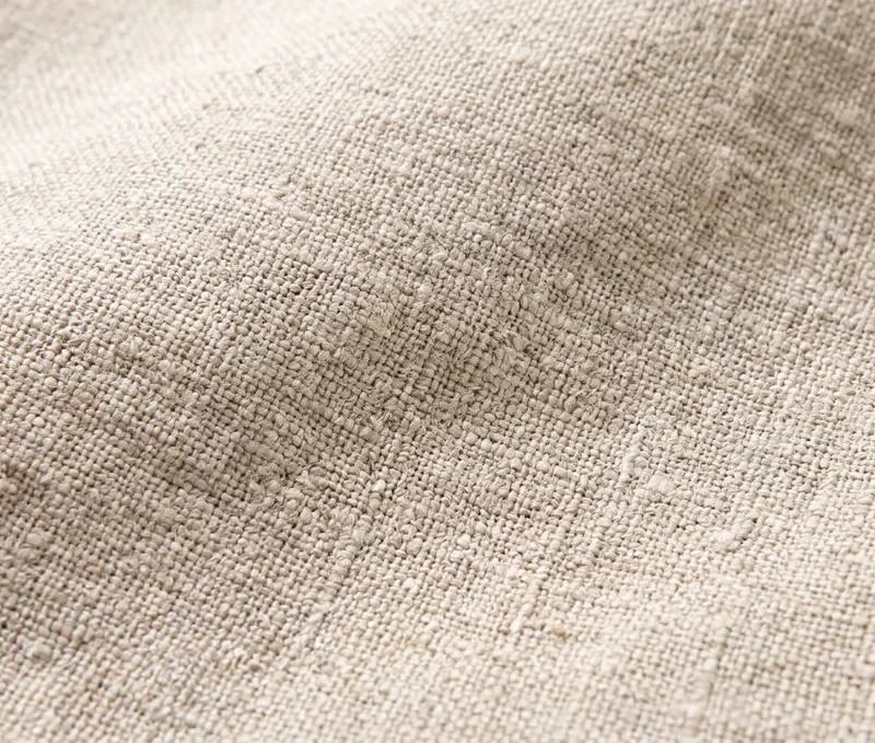 Gros plan sur la texture d'un tissu en lin beige clair